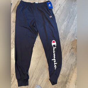Champion sweatpants, Dark Blue with Champion name down side.